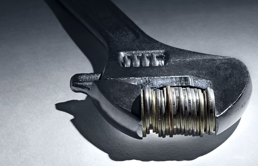 Quarters in the jaws of a crescent wrench Quarters in the jaws of a crescent wrench