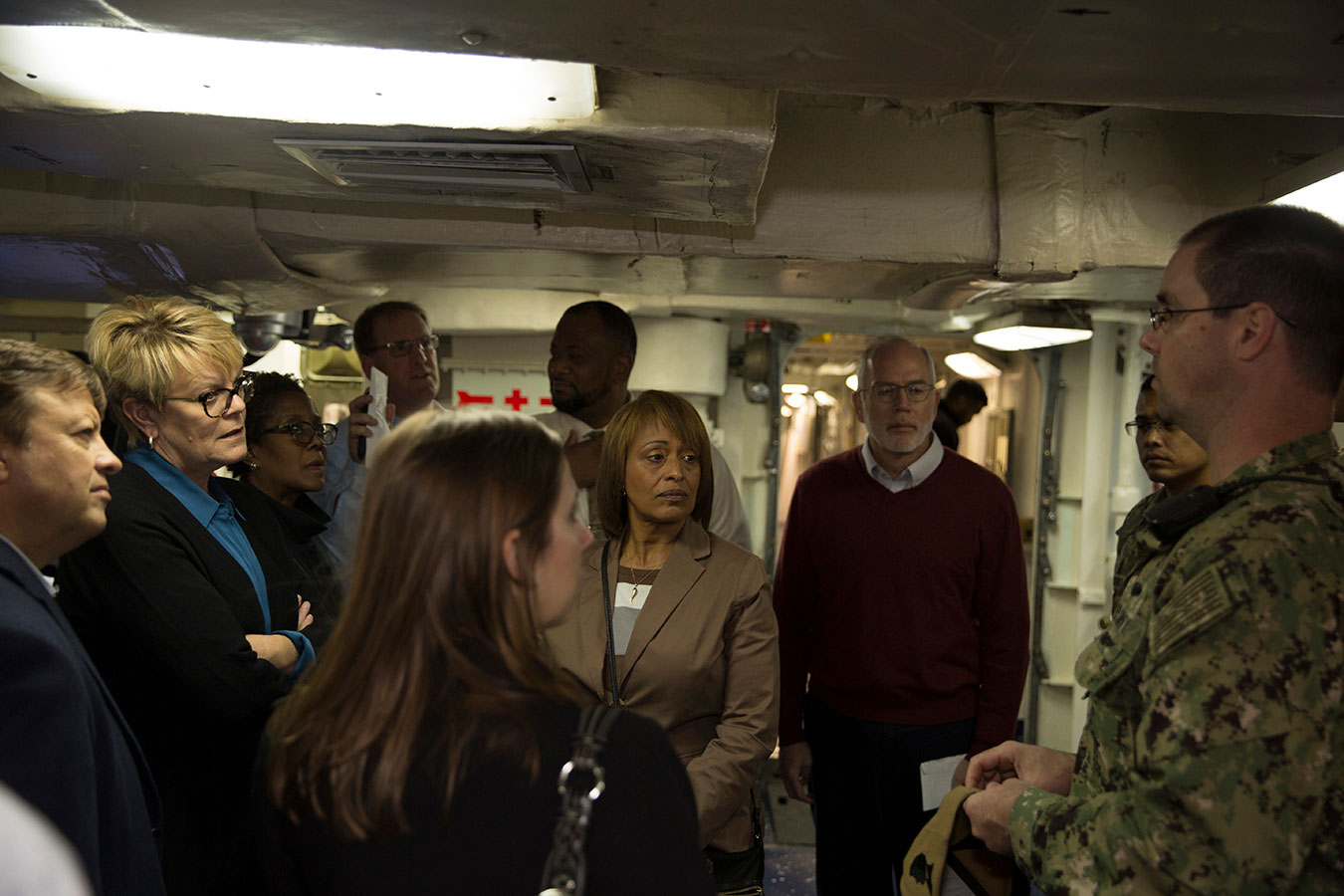 Fiscal Service staff and Navy personnel inside ship