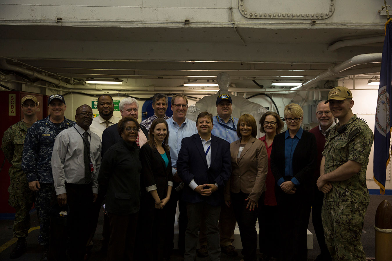 Fiscal Service leadership and Navy personnel inside ship